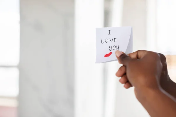 Black Female Hand Putting Sticky Note With Romantic Message On Mirror — Foto de Stock