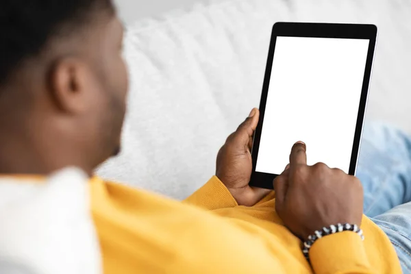 Modern digital tablet with blank screen in black guy hands — 图库照片