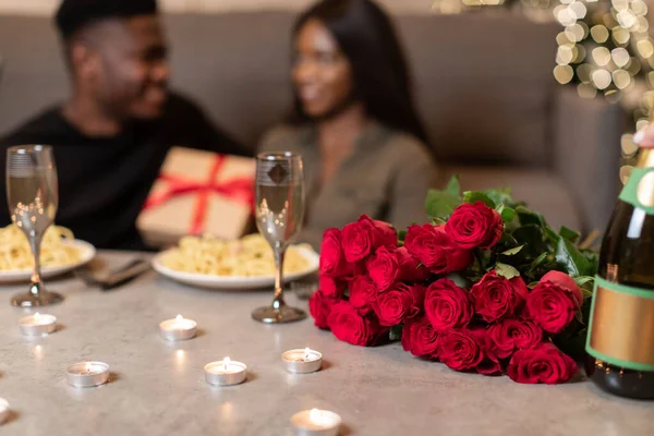 African Couple Celebrating Valentines Day Indoor, Selective Focus On Flowers — стоковое фото