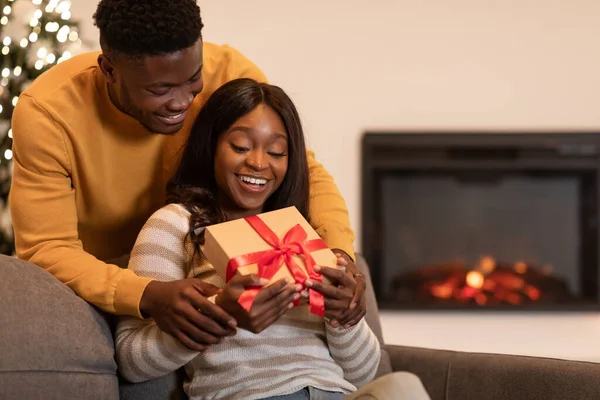 Black Husband Surprising Wife Giving Present Celebrating Valentines Day Indoor — Fotografia de Stock