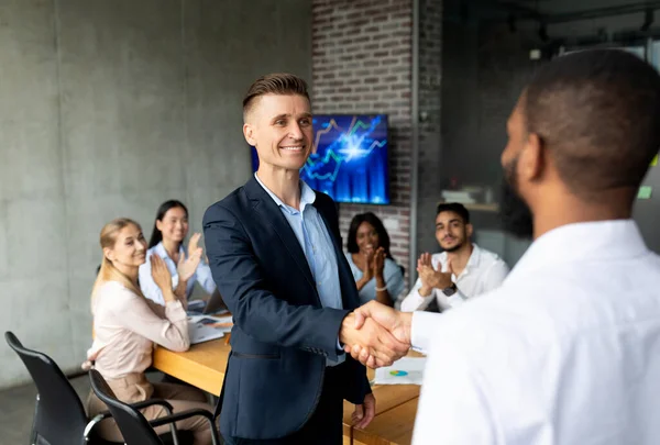 Were Hiring. Male HR Manager Handshaking With African American Employee In Office — Stock fotografie