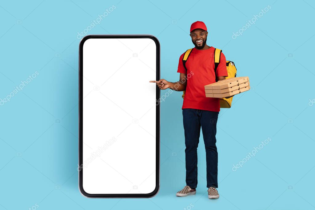 Mobile App. Black Delivery Guy Holding Pizza Boxes Pointing At Blank Phone