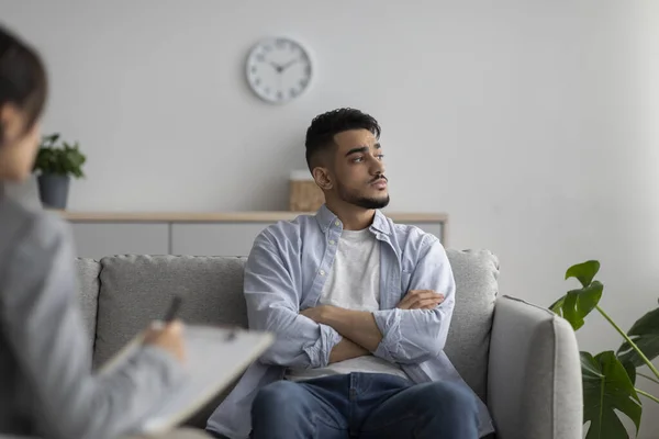 Psychotherapy concept. Depressed arab guy at counselors office, seeking professional help with mental disorder — Foto de Stock