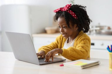 Distance Learning. Cute Little Black Girl Study With Laptop At Home
