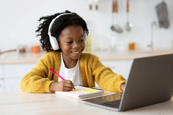 Online Education. Little Black Girl Wearing Headphones Study With Laptop At Home — Fotografia de Stock