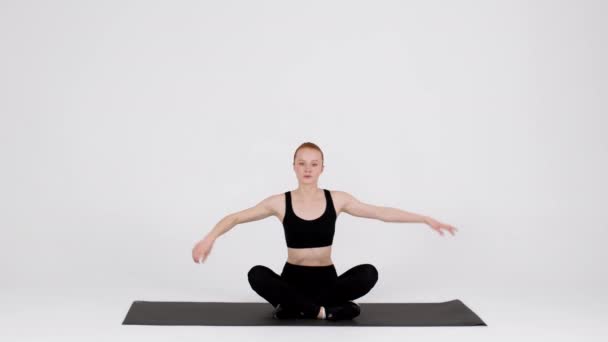 Athletic Young Woman Stretching Neck Muscles While Training In Studio — Video