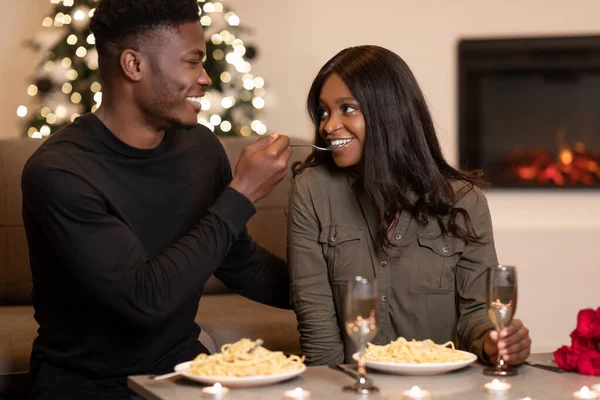 African American Husband Feeding Wife Flirting During Romantic Date Indoor — Zdjęcie stockowe