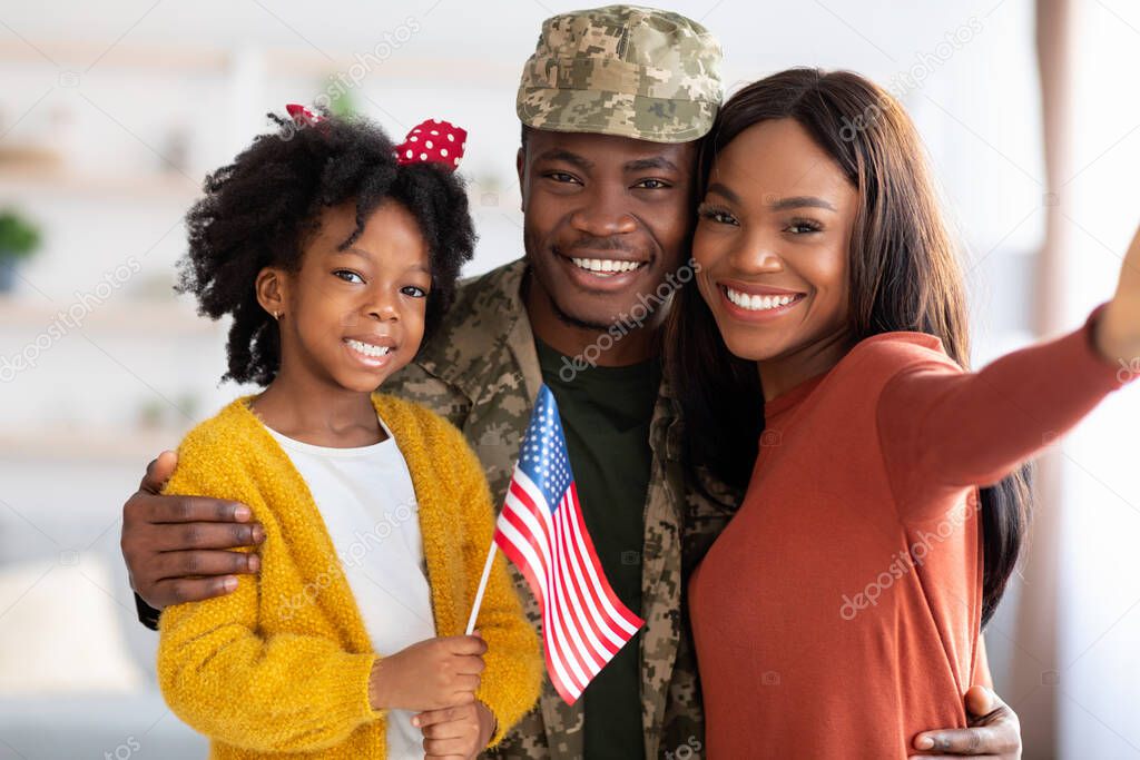Happy American Soldier Taking Selfie With Family After Returning Home From Army