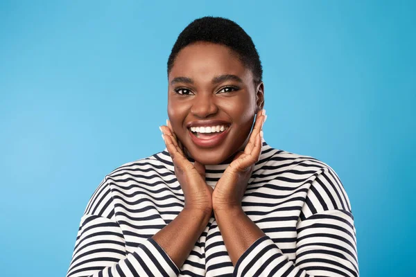 Happy Black Woman Touching Face Smiling To Camera, Blue Background — Stock Fotó