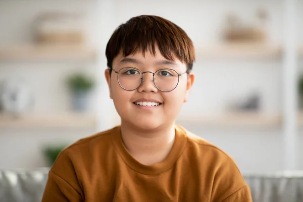 Closeup portrait of cheerful chubby asian kid smiling at camera — Fotografia de Stock