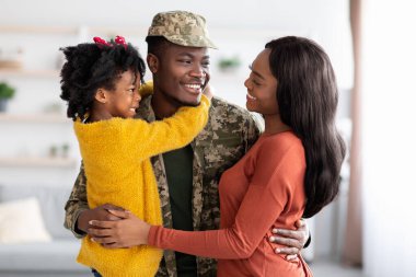 Happy Black Wife And Daughter Welcoming Military Father At Home After Army