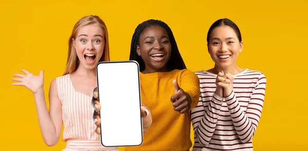 Pretty multiracial ladies posing with modern smartphone, mockup — Stok fotoğraf
