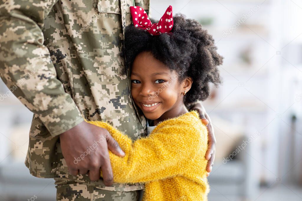 Little Black Girl Embracing Dad In Military Uniform After Return From Army