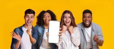 Cheerful multiracial friends using entertaining mobile apps