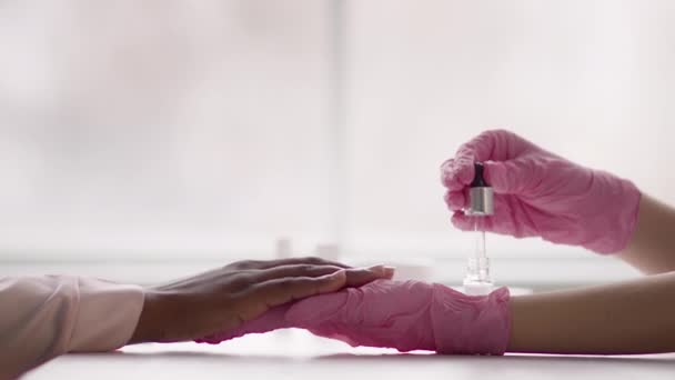 Lady Applying Serum On Cuticle Making Manicure For Client, Closeup — Video