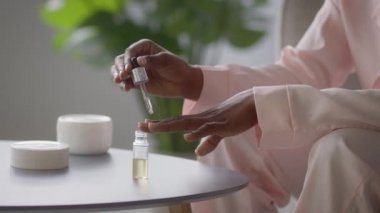 Lady Caring For Nails And Cuticle Applying Serum Indoor, Cropped