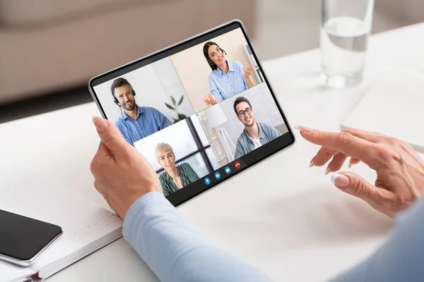 Woman Using Digital Tablet For Video Conference With Group Of Business People — Stock Fotó
