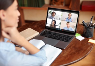 Webinar Concept. Young Woman Having Group Video Conference With Business People