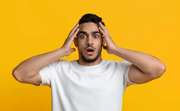 Shocked middle eastern man touching his head — Stok fotoğraf