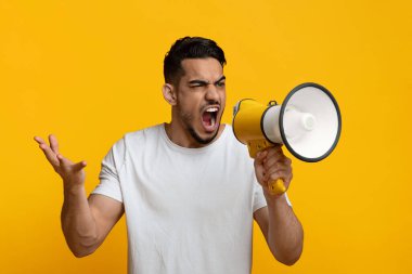 Angry middle eastern guy with loudspeaker gesturing