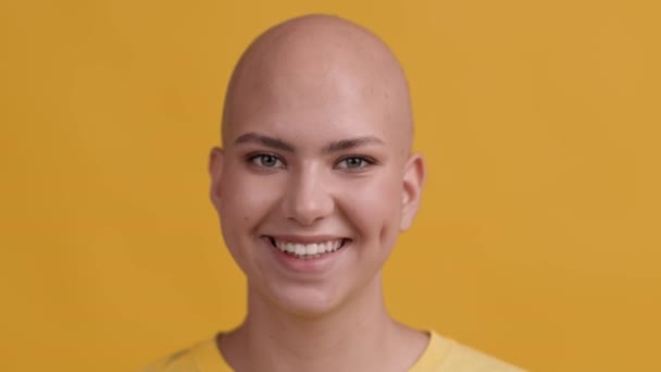 Portrait Of Cheerful Hairless Lady Smiling Posing Over Yellow Background — Stock Video