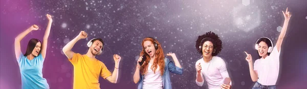 Carefree diverse millennial people listening to cool songs in wireless headphones and dancing over cosmic background — Stock Photo, Image
