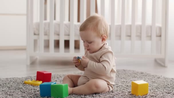 Portrait Of Adorable Infant Baby Playing With Pacifier At Home — Stock Video
