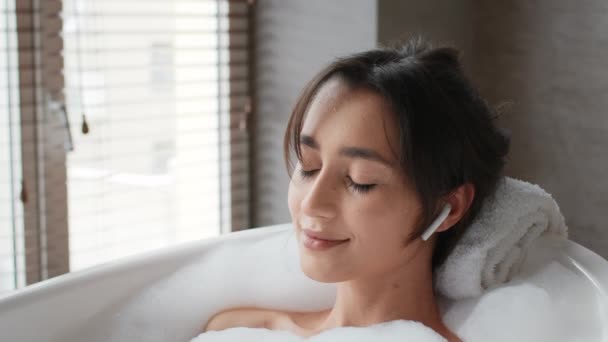 Woman Taking Bath With Foam Listening Relaxing Music In Bathroom — Stock Video