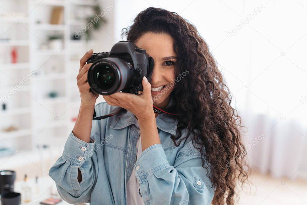 Professional Photographer Lady Taking Photo Smiling Holding Photocamera Standing Indoors