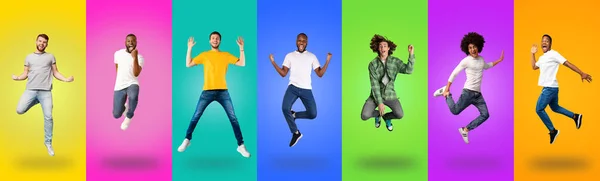 Carefree millennial guys of different races jumping up — Photo