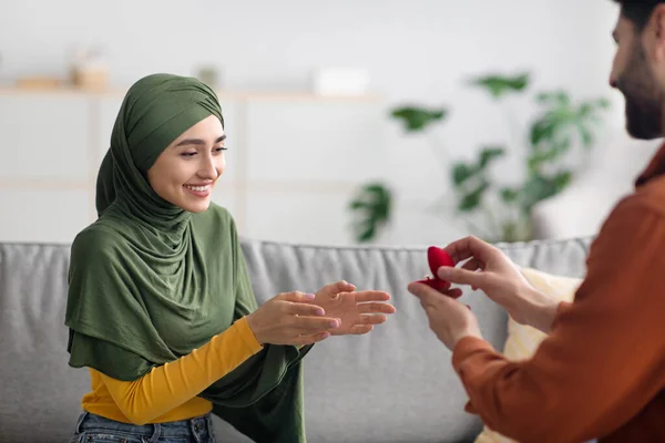 Middle Eastern Boyfriend Proposing To Girlfriend Giving Engagement Ring Indoors — Stock Photo, Image