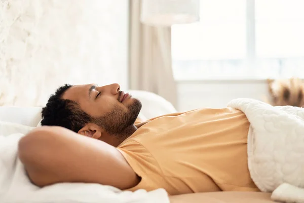 Middle Eastern Male Sleeping Lying In Cozy Bed In Bedroom — Zdjęcie stockowe