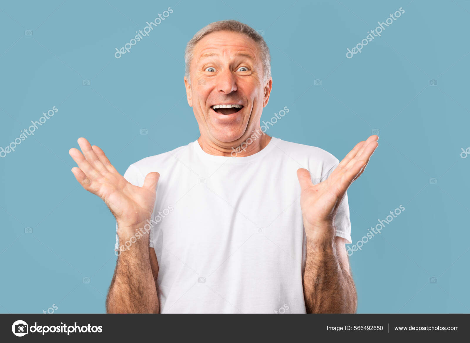 Happy Mature Guy Raising His Hands Up In Excitement Стоковое Фото.
