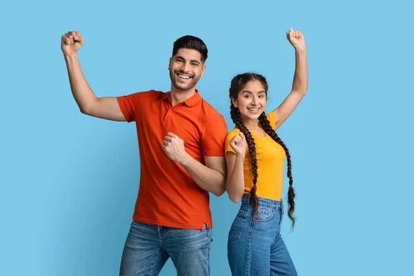 Big Success. Portrait Of Overjoyed Young Arabic Couple Raising Fists With Excitement — Foto de Stock
