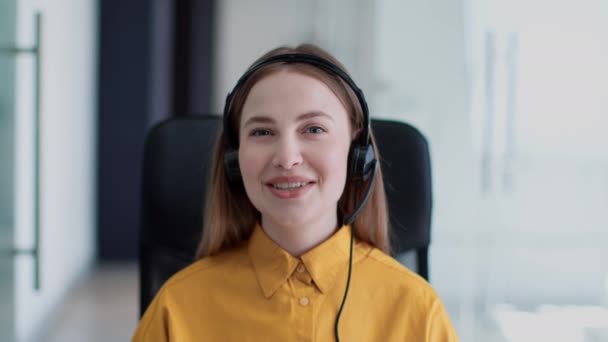 Video chat of helpline. Webcam pov portrait of young woman customer support operator in headset talking to client — Stok video