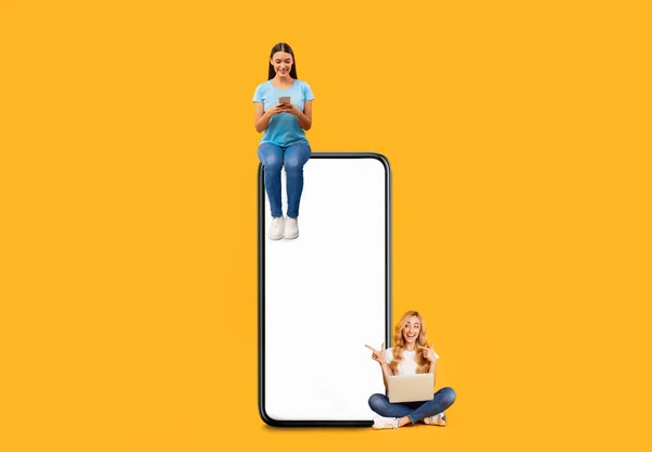 People sitting on white empty smartphone screen and using gadgets — Stockfoto