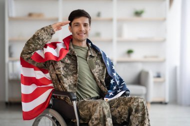 Patriotic veteran sitting in wheelchair with flag of the US