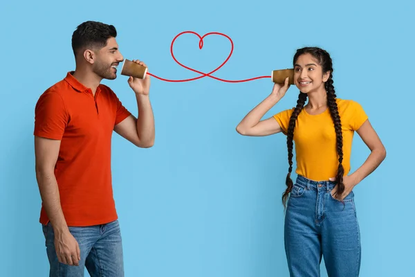 Love Message. Arab Guy Telling Romantic Words To Girlfriend Through Tin Phone — Stok Foto