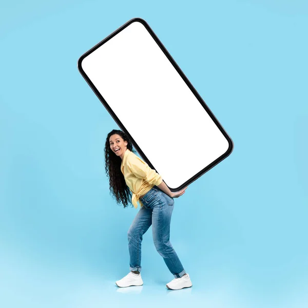 Excited lady holding heavy white empty smartphone screen — Foto Stock