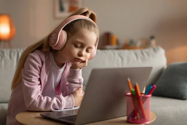 Tired Little Schoolgirl Sleeping Near Laptop Learning Online At Home — Fotografia de Stock