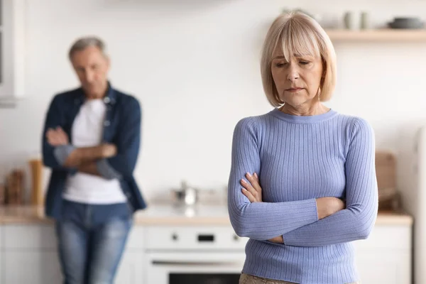 Upset mature lady crying, having quarrel with her husband — Photo