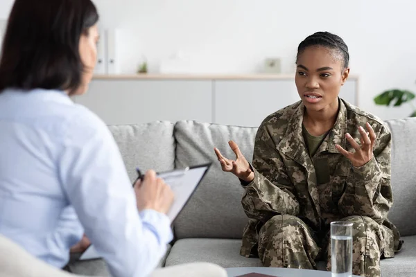 Black Young Military Lady Explaining Her Problems To Female Psychotherapist