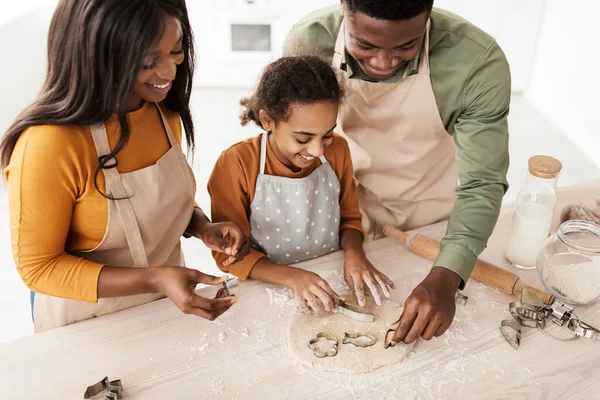 Black Family Using Baking Forms Making Cookies In Kitchen