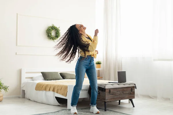 Excited lady listening to music and dancing at home — Foto Stock