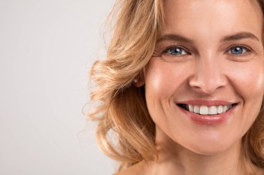 Crows Feet Concept. Closeup Portrait Of Beautiful Smiling Female Looking At Camera