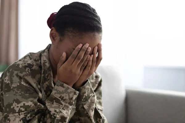 Depression Concept. Upset African American Soldier Lady Covering Face With Hands