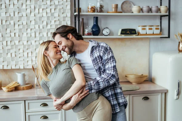 Glad happy european young male with stubble and blonde female enjoy free time have fun hugging and dancing — Stock Photo, Image
