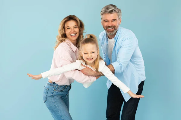 Happy Family Three Having Fun Posing Together Blue Studio Background — 스톡 사진