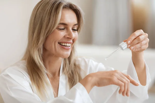 Happy Attractive Adult Blonde Woman Silky Bathrobe Testing Newest Facial — Stock Photo, Image