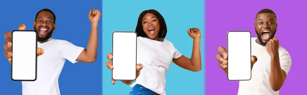 Emocjonalne Młode Czarne Osoby Pokazujące Zupełnie Nowe Telefony Komórkowe Białymi — Zdjęcie stockowe